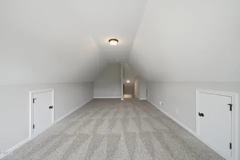 a view of an empty room with a fan