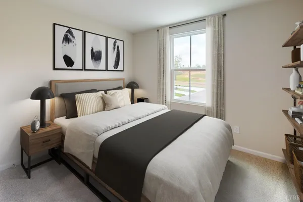 a bedroom with a bed and a painting on the wall
