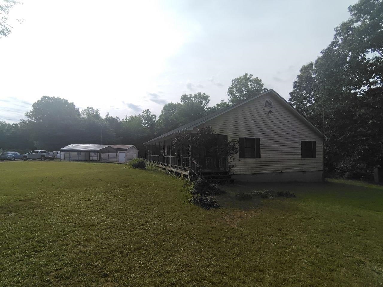 1475 Authur Byrd Road Pocahontas, TN 38061 - Photo 33 of 37 Spacious residential structure with horizontal siding and a covered porch