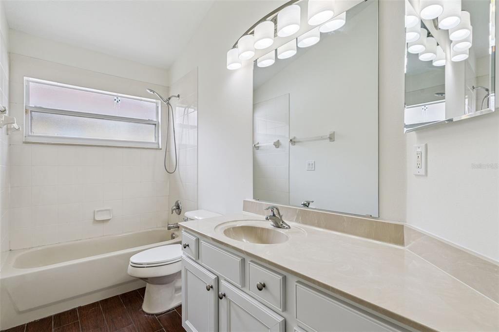 2440 Holly Ridge Court Clermont, FL 34711 - Photo 15 of 43 a bathroom with a sink a toilet and a bathtub