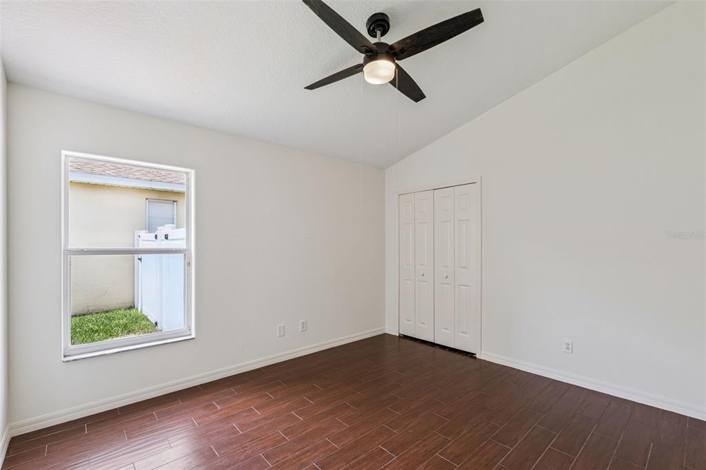 2440 Holly Ridge Court Clermont, FL 34711 - Photo 16 of 43 an empty room with a window and a ceiling fan