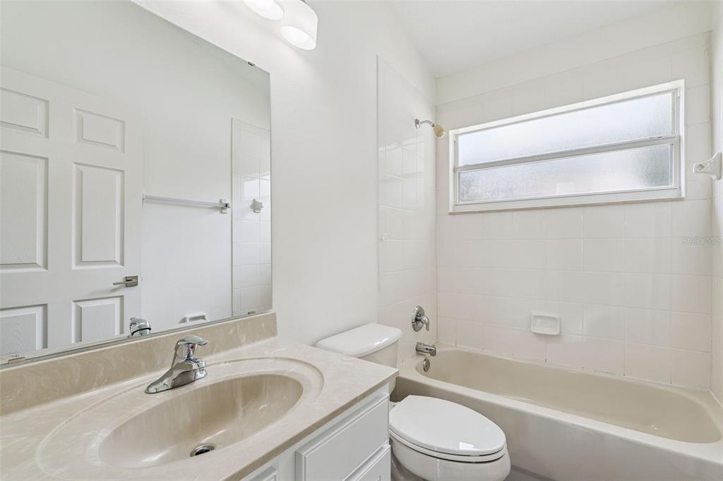 2440 Holly Ridge Court Clermont, FL 34711 - Photo 18 of 43 a bathroom with a sink toilet and shower