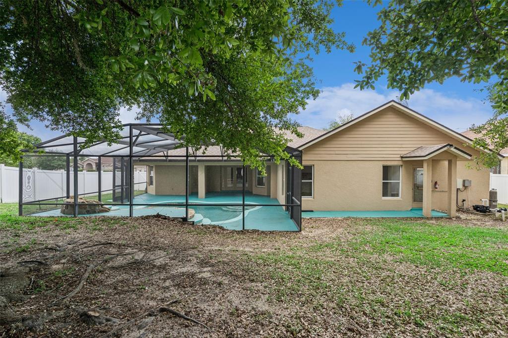 2440 Holly Ridge Court Clermont, FL 34711 - Photo 2 of 43 a house that has a tree in front of it