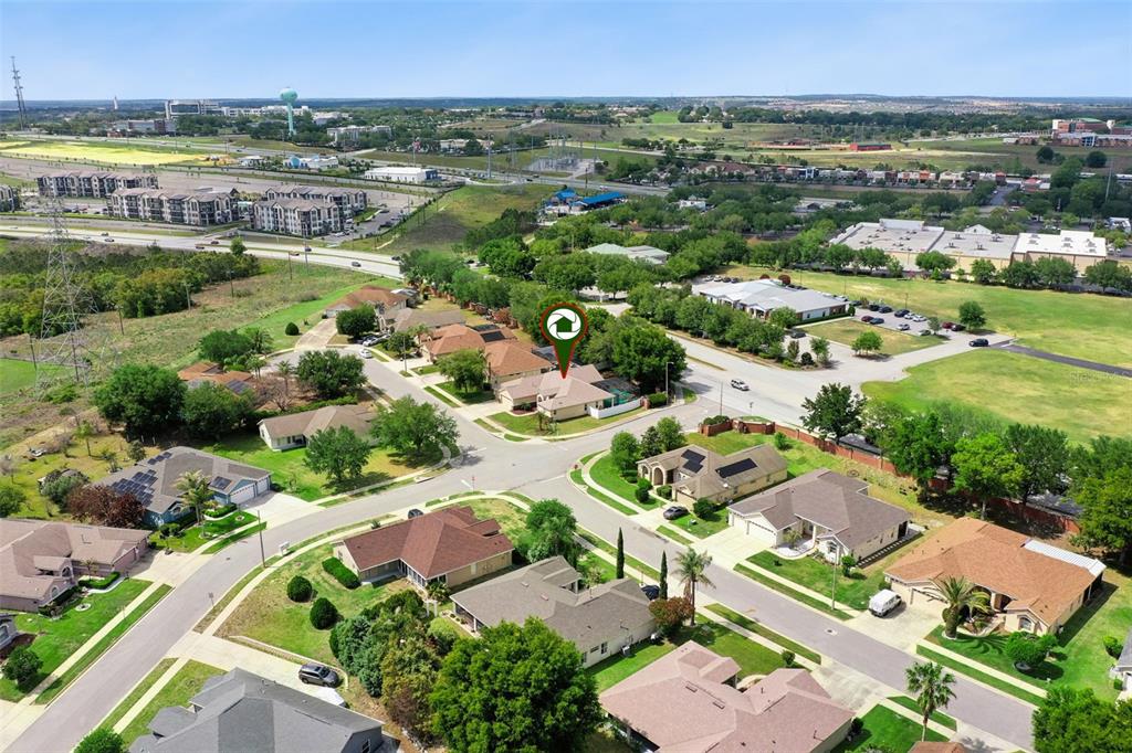 2440 Holly Ridge Court Clermont, FL 34711 - Photo 22 of 43 an aerial view of residential houses with outdoor space