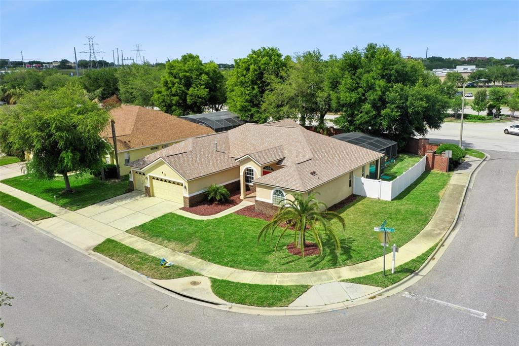 2440 Holly Ridge Court Clermont, FL 34711 - Photo 23 of 43 an aerial view of a house with a garden and trees