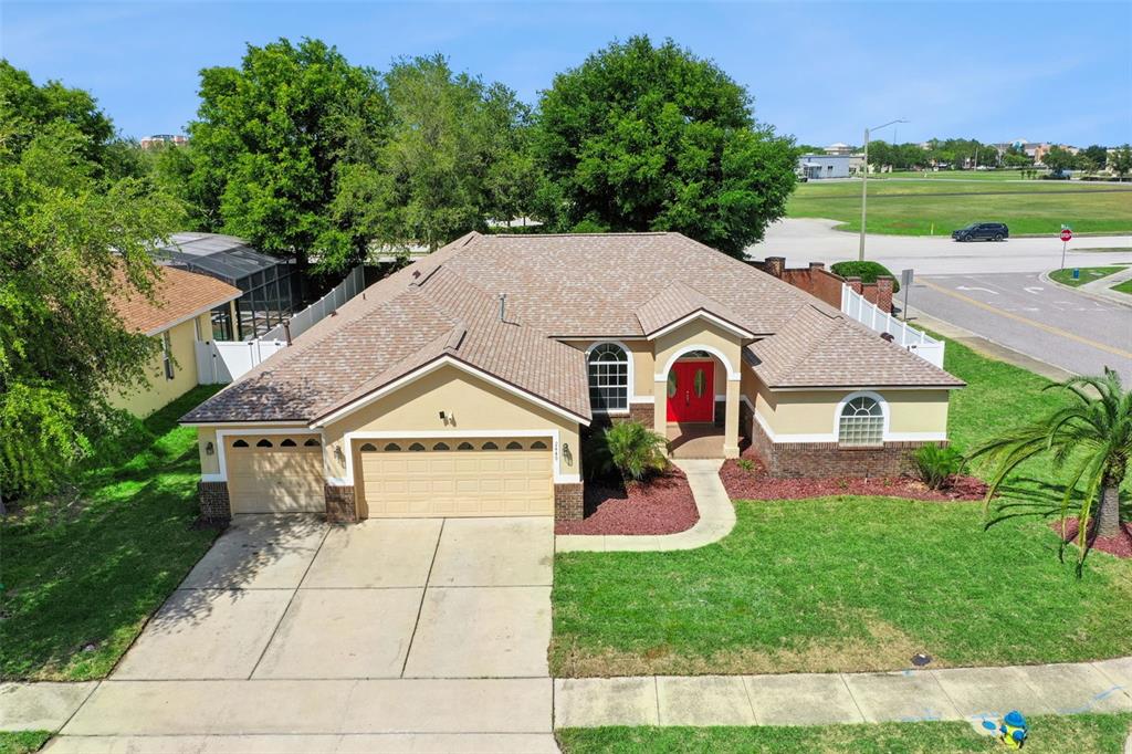 2440 Holly Ridge Court Clermont, FL 34711 - Photo 24 of 43 a front view of house with yard and green space