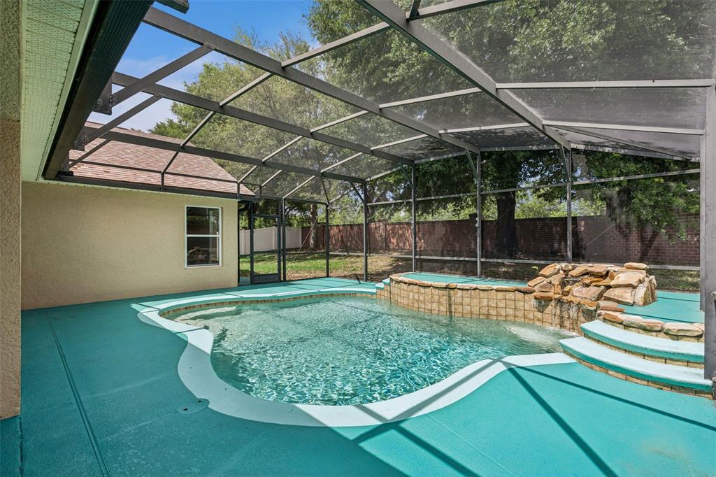 2440 Holly Ridge Court Clermont, FL 34711 - Photo 3 of 43 a view of a backyard with swimming pool