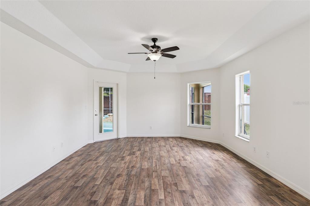 2440 Holly Ridge Court Clermont, FL 34711 - Photo 32 of 43 wooden floor in an empty room with a window