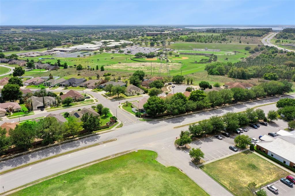 2440 Holly Ridge Court Clermont, FL 34711 - Photo 41 of 43 an aerial view of residential houses with outdoor space and trees