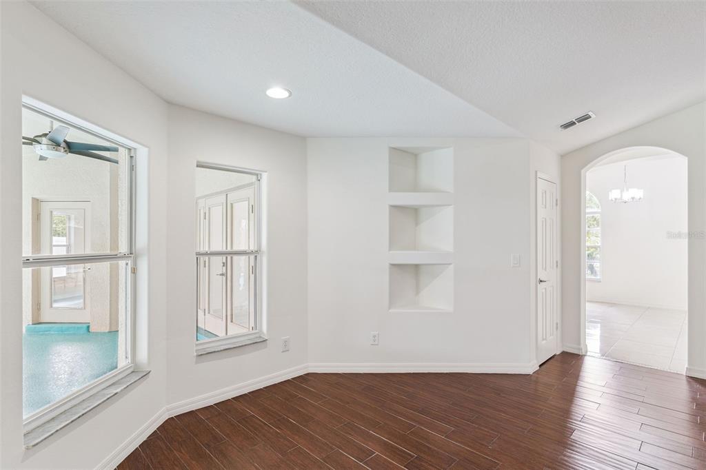 2440 Holly Ridge Court Clermont, FL 34711 - Photo 9 of 43 a view of empty room with wooden floor and entryway