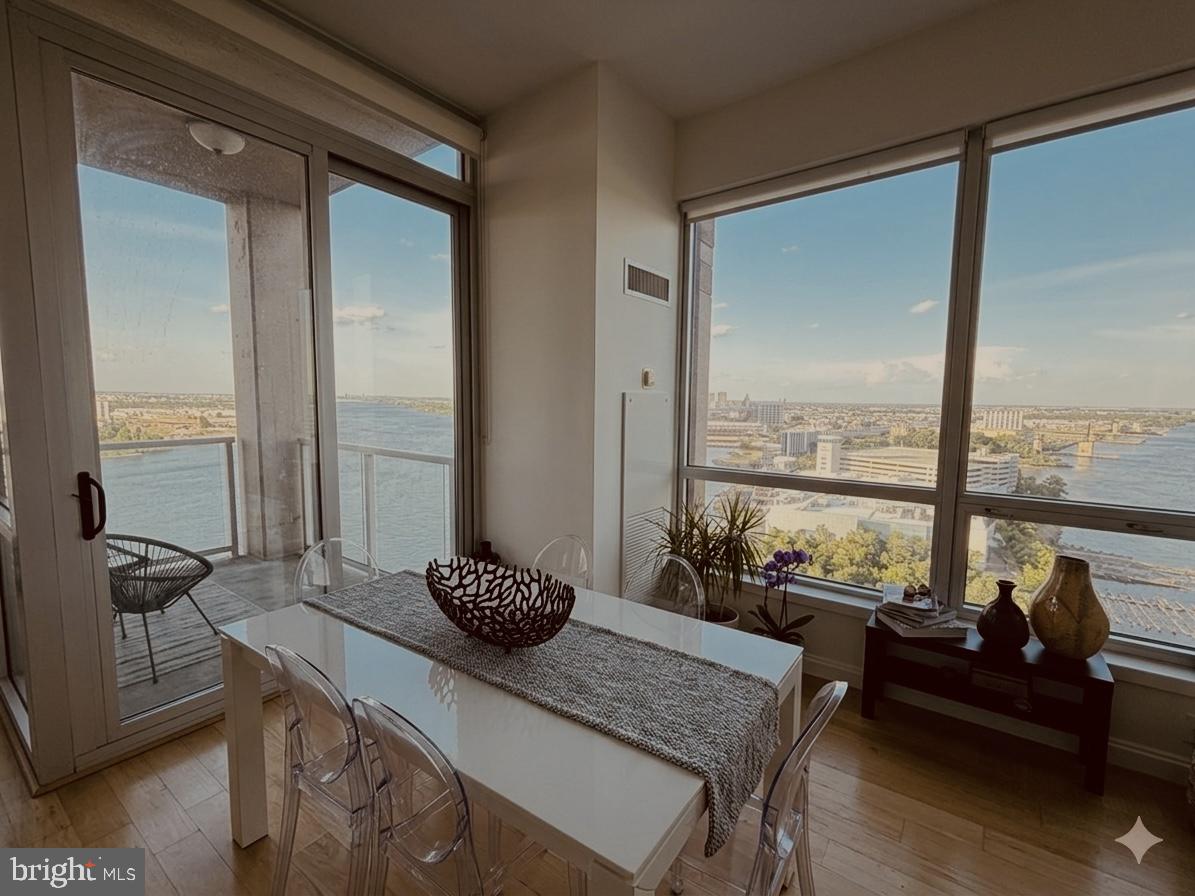 901 North Penn Street, Unit R2101 Philadelphia, PA 19123 - Photo 16 of 33 a living room with furniture and floor to ceiling windows