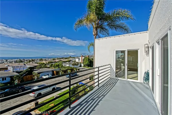 a view of a balcony with wooden floor