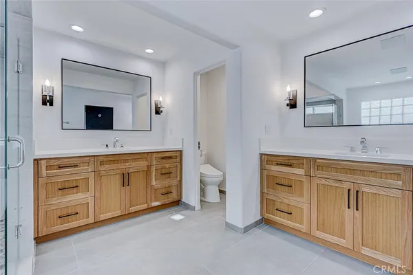 a view of a bathroom with a sink and mirror