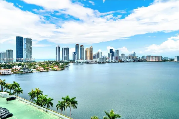 a view of a lake with a city