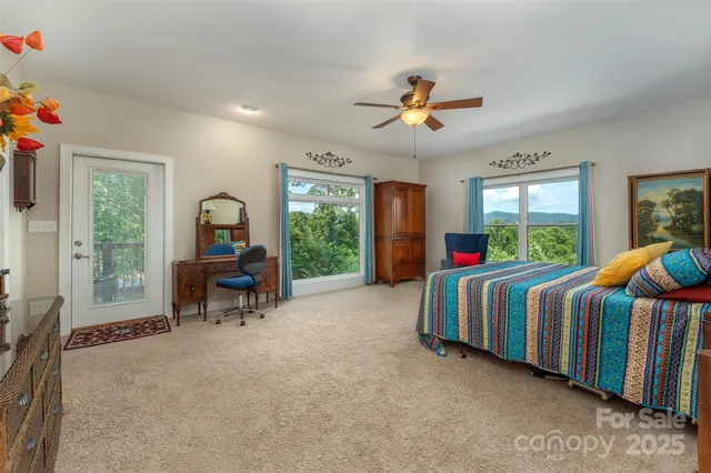 a bedroom with two beds and a chandelier