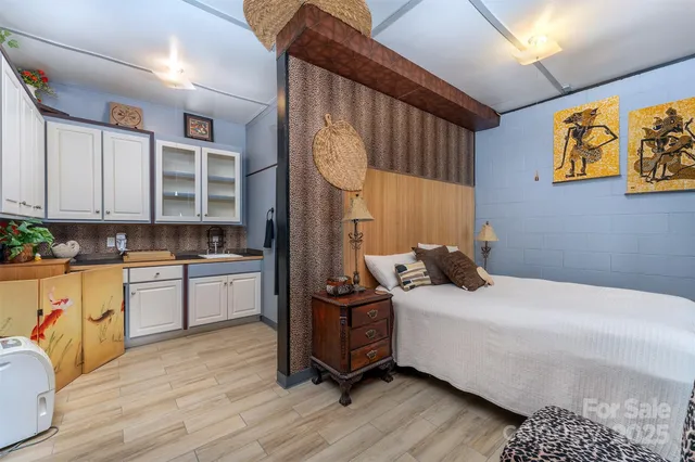 a bedroom with a bed and a cabinets