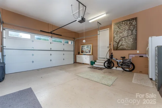 a view of a garage with storage and utility