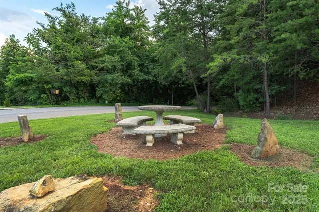 a view of a backyard with sitting area