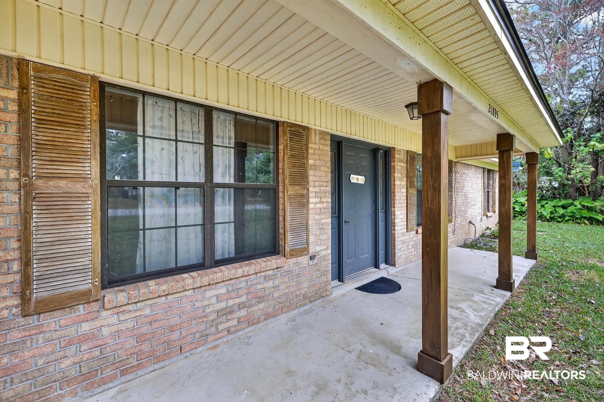 21895 2nd Street Silverhill, AL 36576 - Photo 3 of 43 Doorway to property with covered porch and brick siding