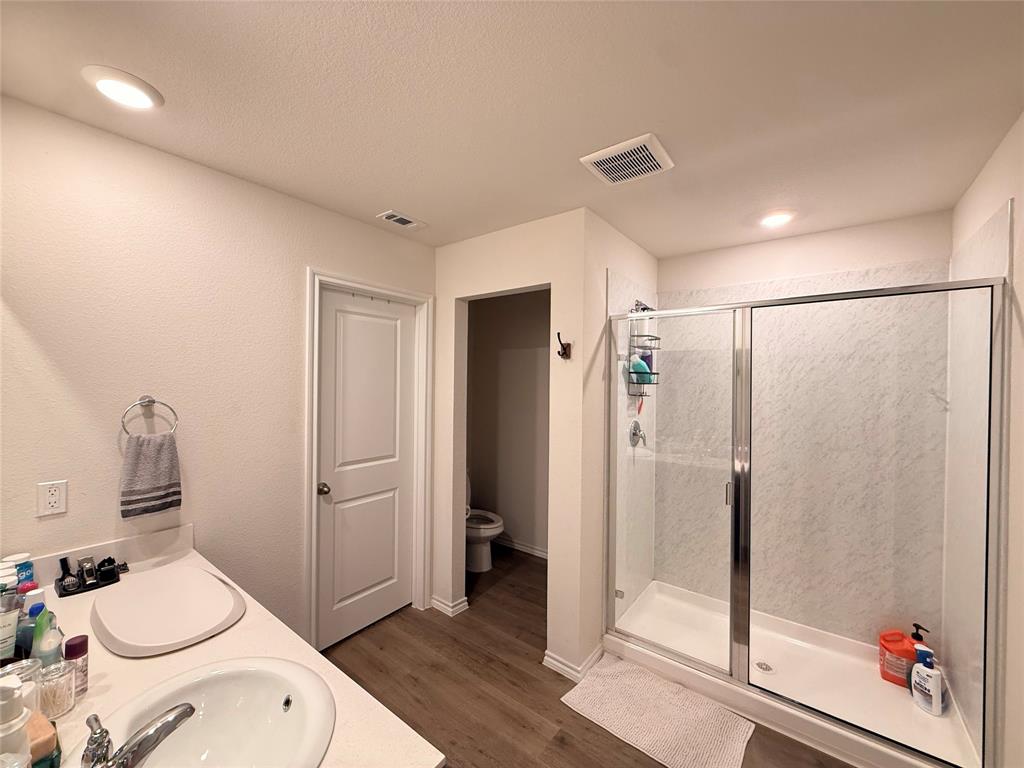 2332 Burleson Road Sherman, TX 75090 - Photo 12 of 21 a bathroom with a shower and a toilet
