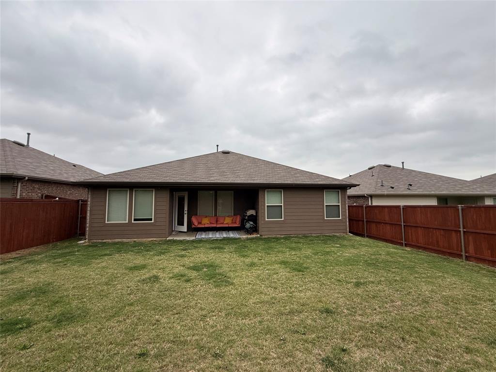 2332 Burleson Road Sherman, TX 75090 - Photo 19 of 21 a view of a house with a yard and fence