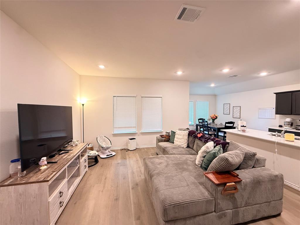 2332 Burleson Road Sherman, TX 75090 - Photo 4 of 21 a living room with furniture and a flat screen tv