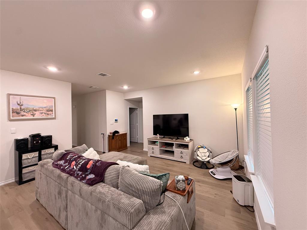 2332 Burleson Road Sherman, TX 75090 - Photo 5 of 21 a living room with furniture and a flat screen tv