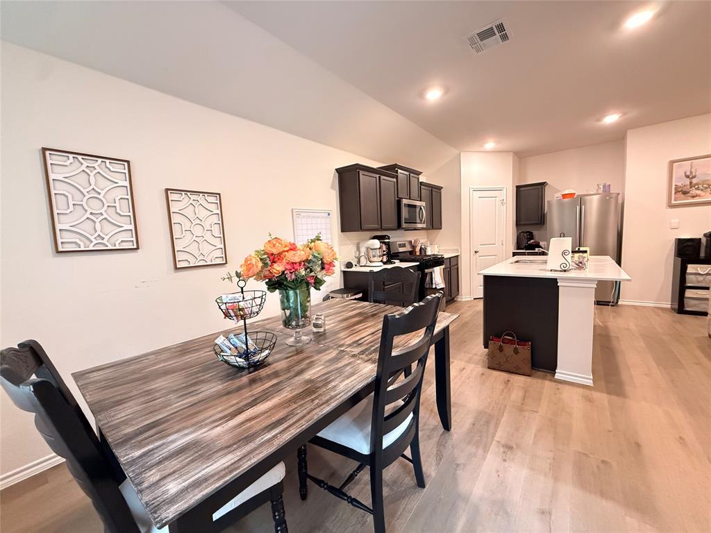 2332 Burleson Road Sherman, TX 75090 - Photo 8 of 21 a dining room with furniture and wooden floor