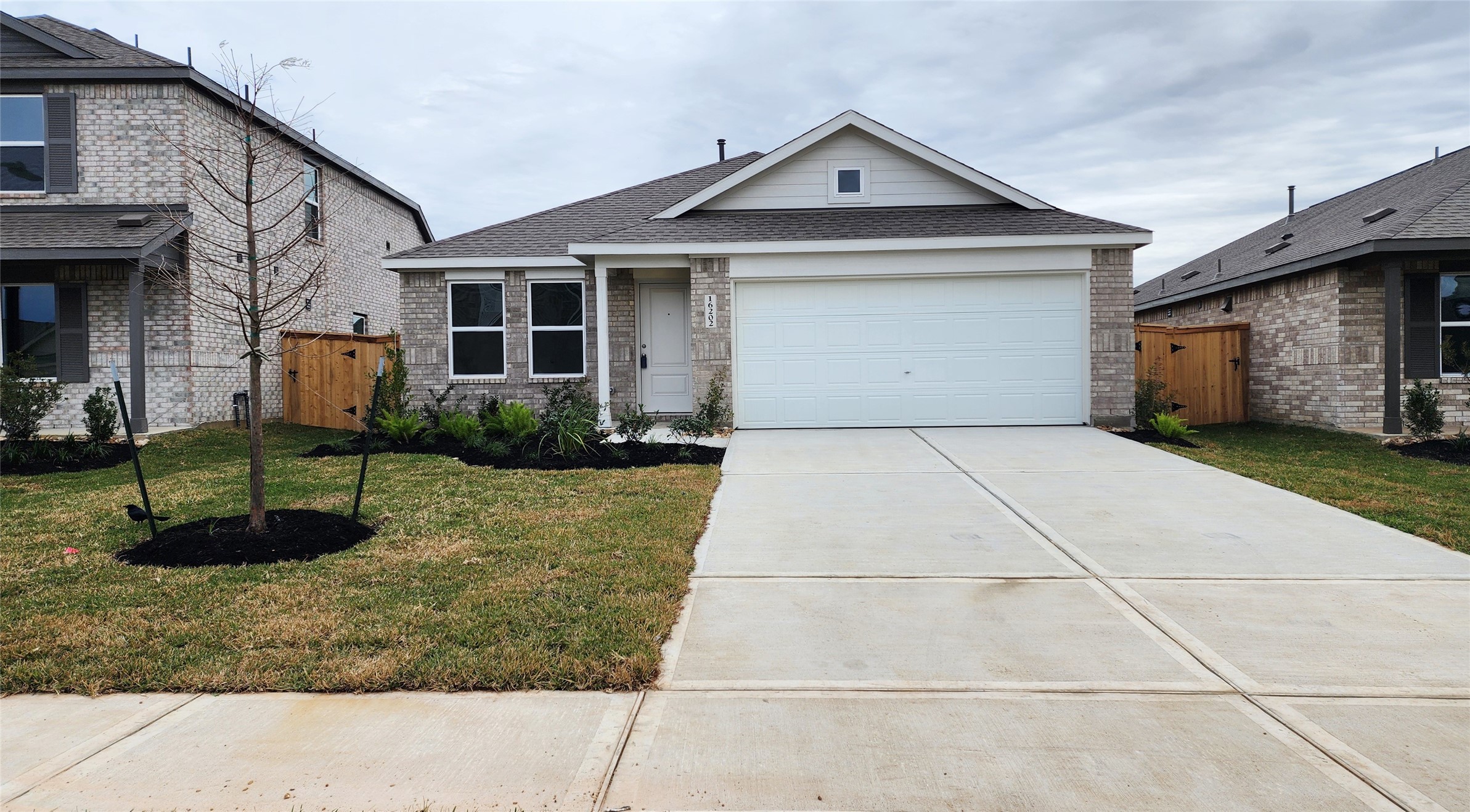 16202 Rustic Prairie Drive Hockley, TX 77447 - Photo 1 of 35 a front view of a house with garden