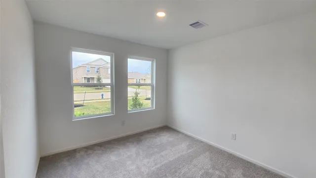 an empty room with windows