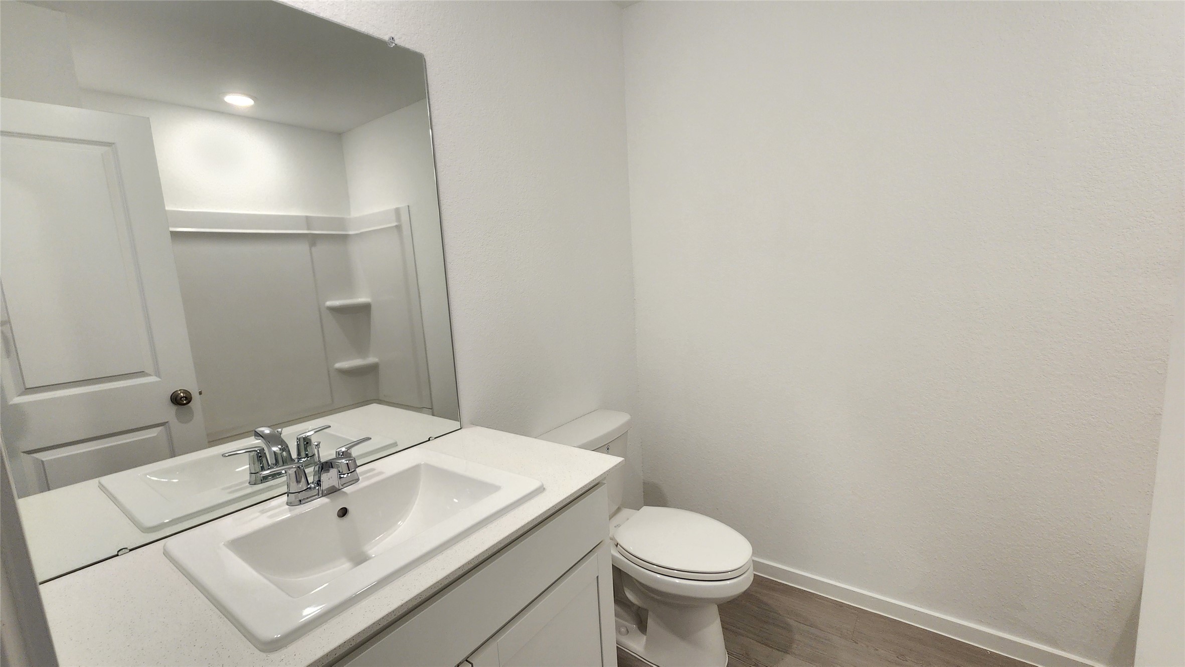 16202 Rustic Prairie Drive Hockley, TX 77447 - Photo 18 of 35 a bathroom with a sink a toilet and mirror
