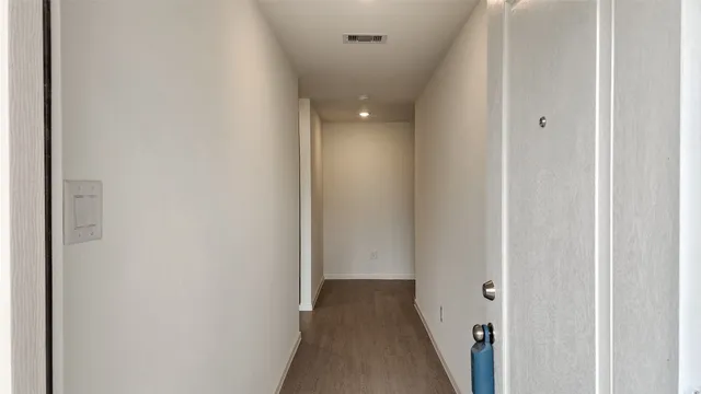 a view of a hallway with a closet