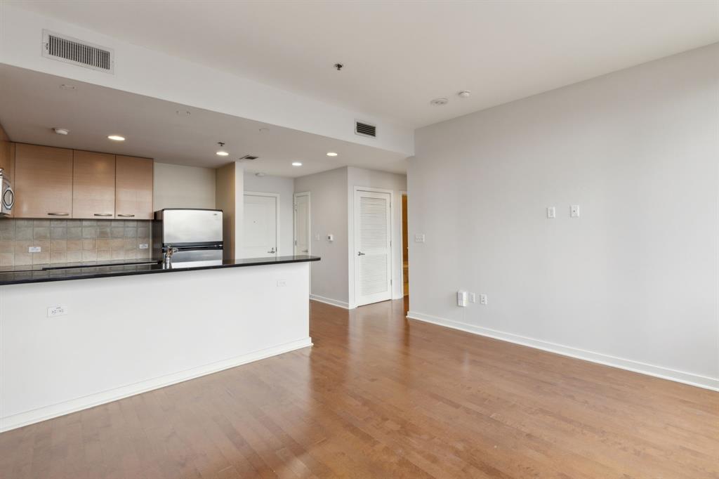1200 Main Street, Unit 2302 Dallas, TX 75202 - Photo 8 of 22 a view of kitchen with stainless steel appliances wooden floor