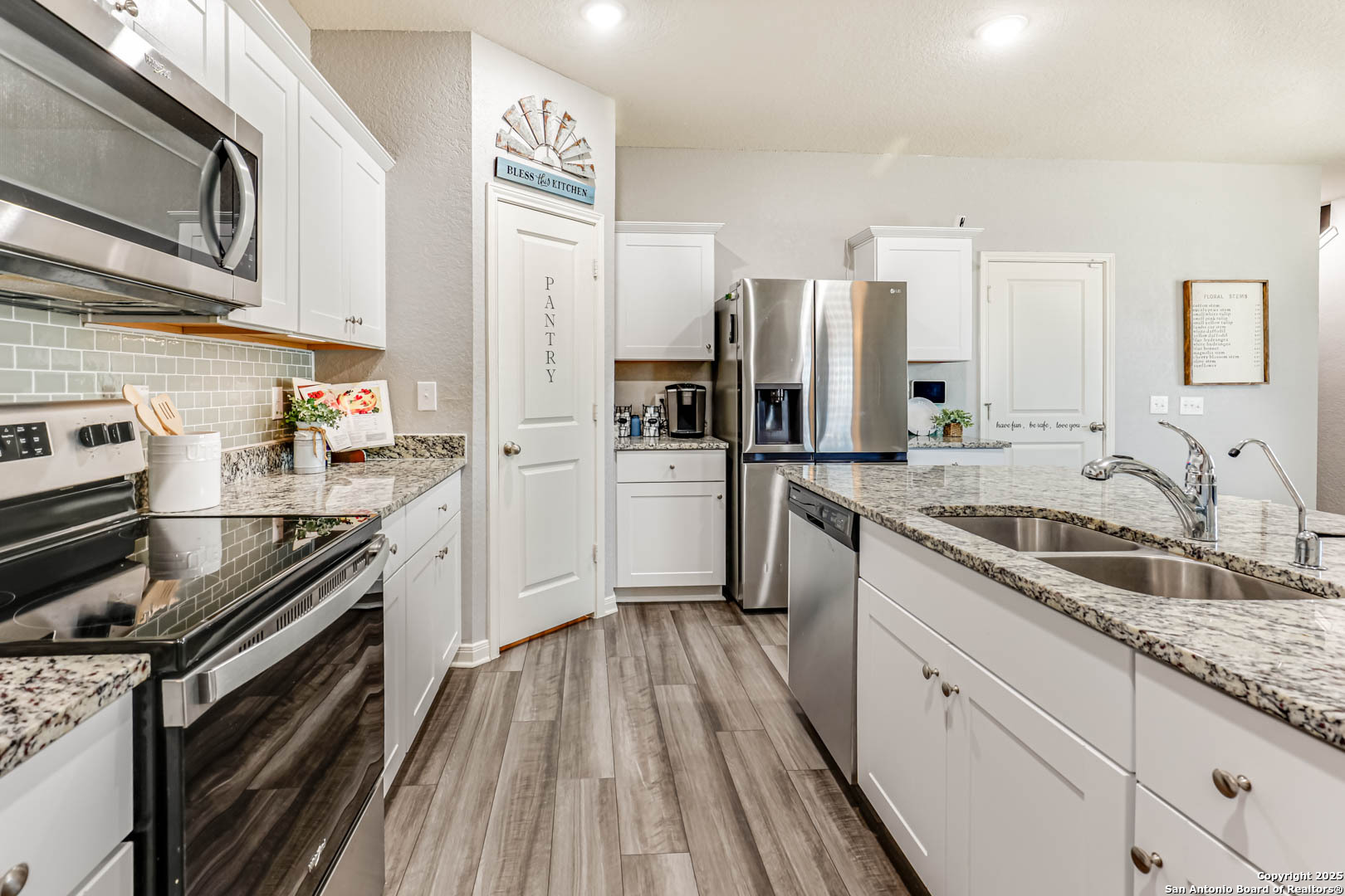 14383 Palm Ridge San Antonio, TX 78253 - Photo 14 of 45 a kitchen with a sink stove and refrigerator