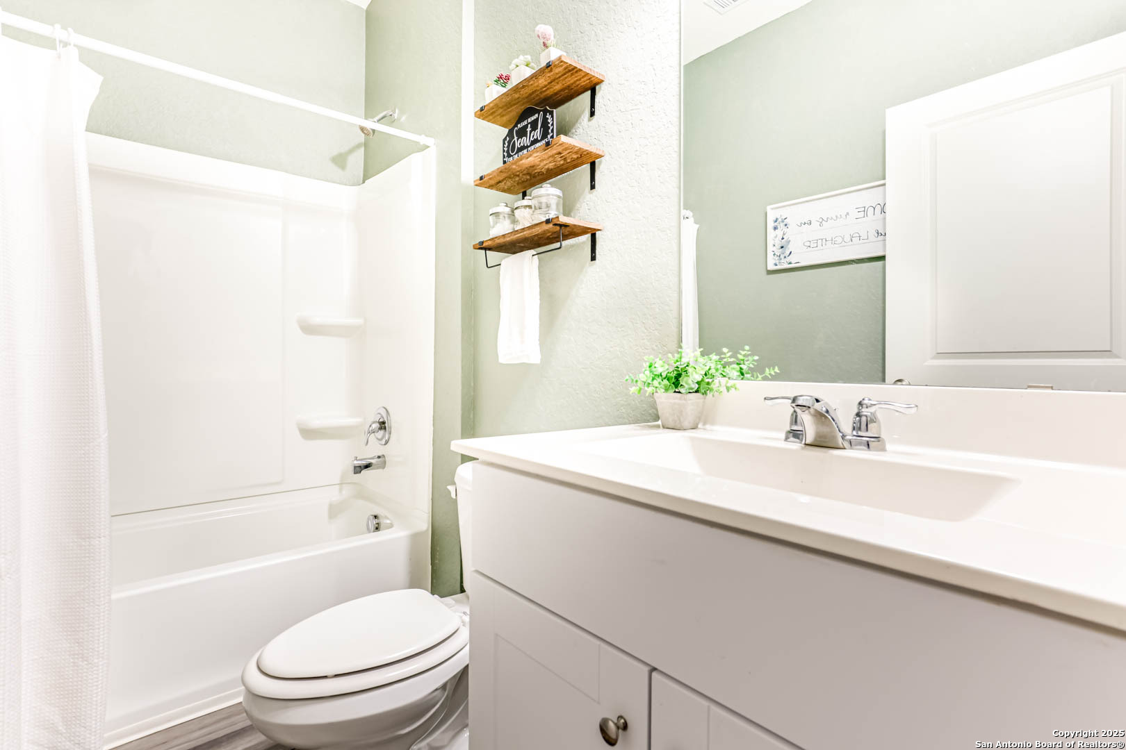 14383 Palm Ridge San Antonio, TX 78253 - Photo 21 of 45 a bathroom with a sink a toilet and shower