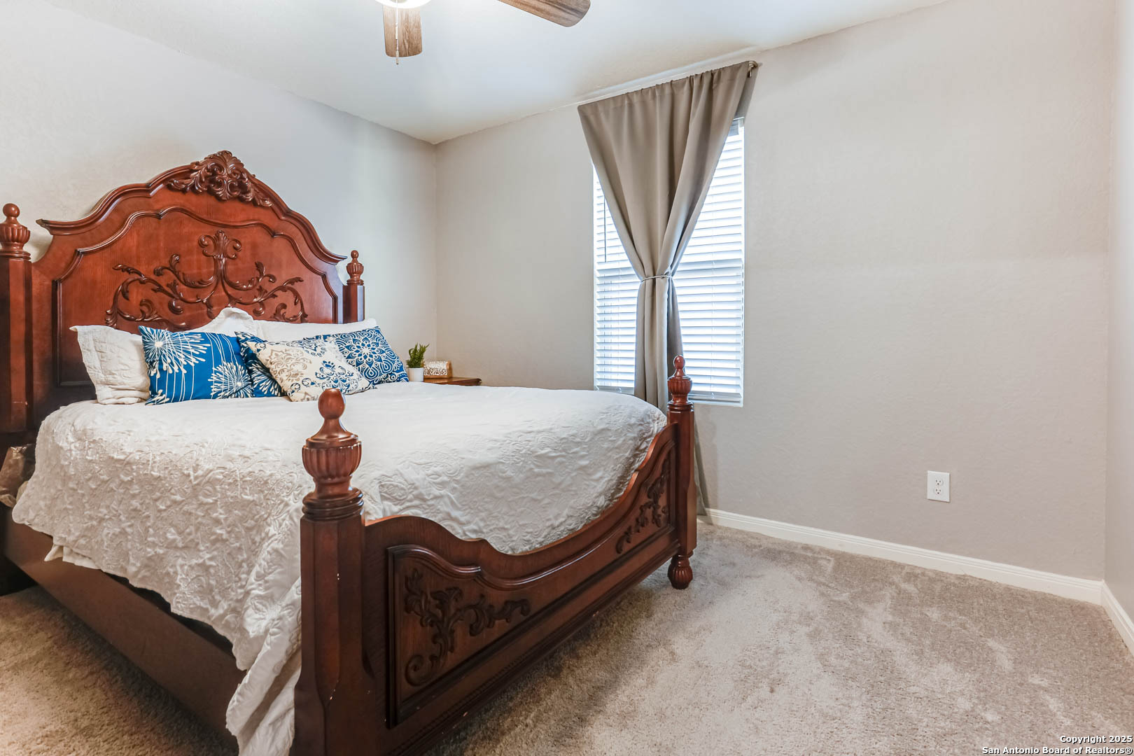 14383 Palm Ridge San Antonio, TX 78253 - Photo 24 of 44 a bedroom with a bed and a painting on the wall