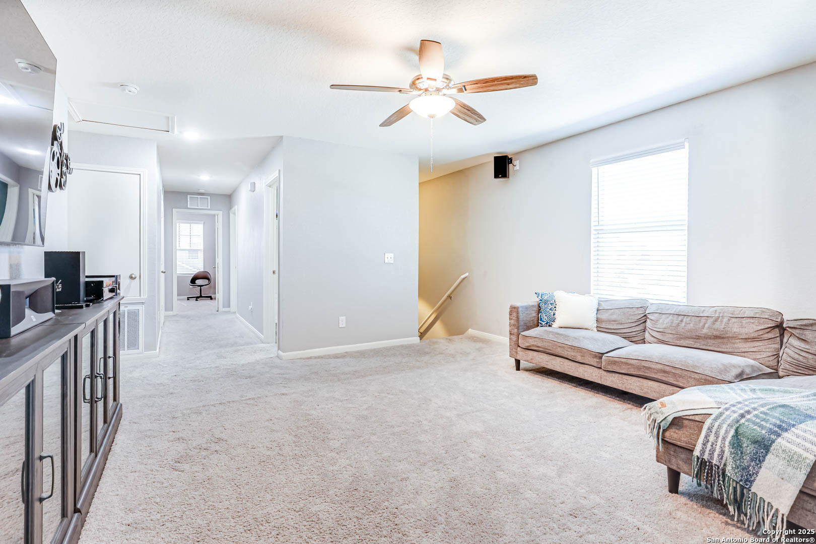 14383 Palm Ridge San Antonio, TX 78253 - Photo 26 of 44 a living room with couches and a ceiling fan