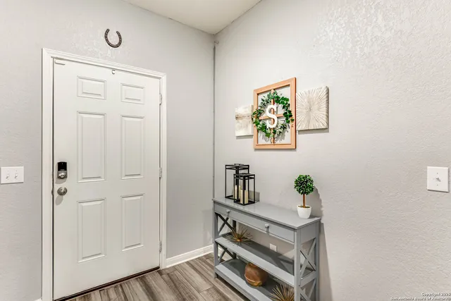 a view of kitchen with furniture and wooden floor