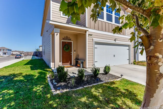 front view of a house with a yard
