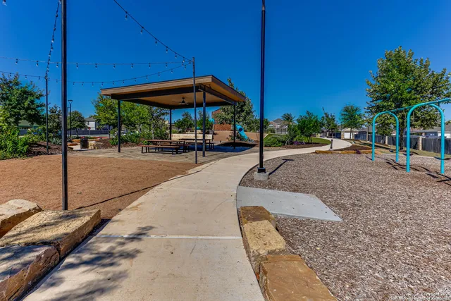 a view of a backyard with sitting area