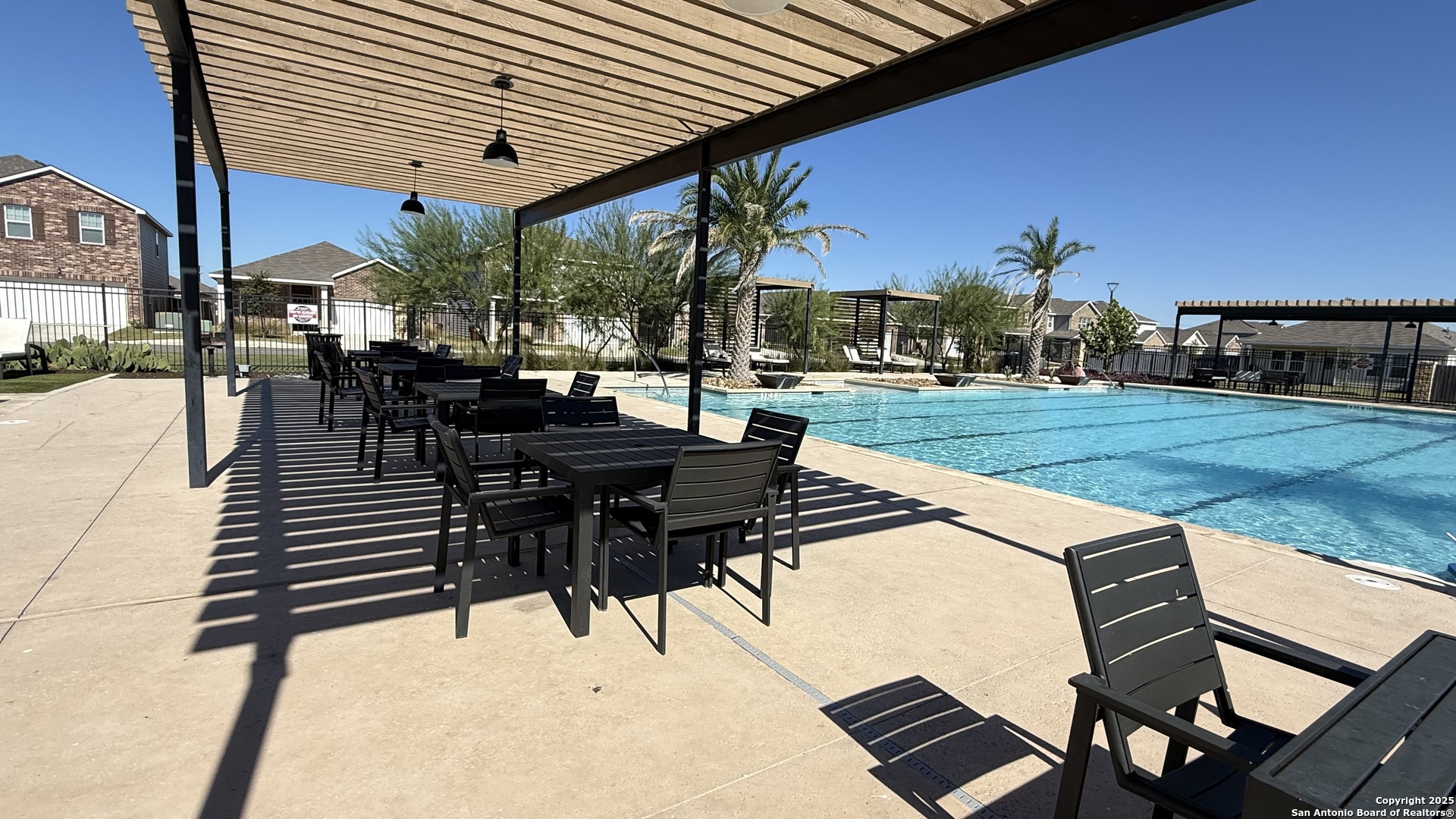 14383 Palm Ridge San Antonio, TX 78253 - Photo 40 of 44 a view of a patio with table and chairs with wooden floor and fence