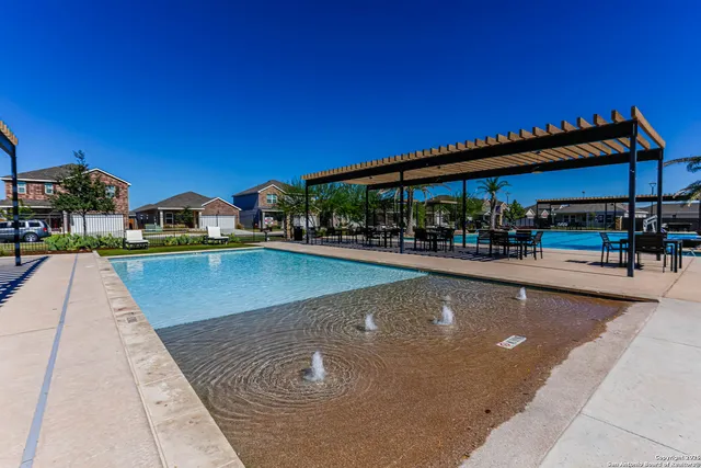 a view of a swimming pool with a patio