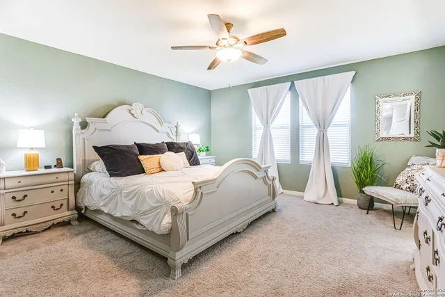 a bed room with a bed and a chandelier