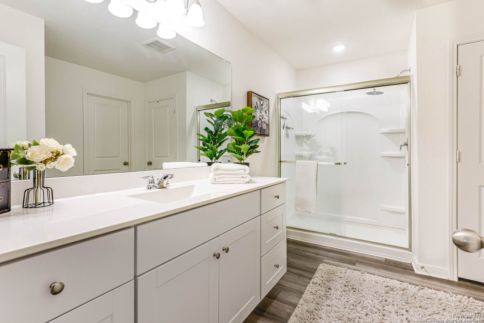 14383 Palm Ridge San Antonio, TX 78253 - Photo 8 of 44 a bathroom with a shower sink and mirror