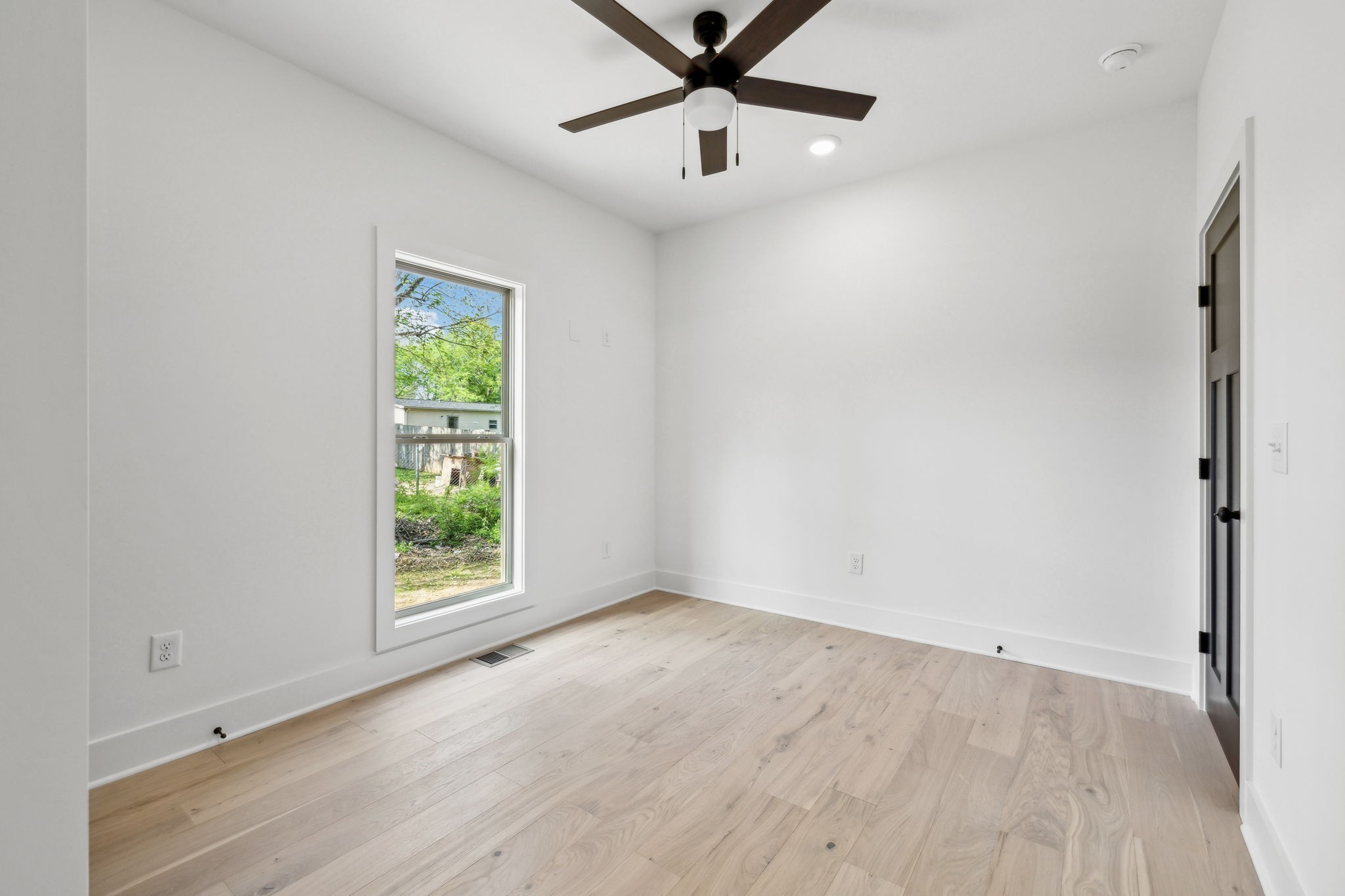 827 Oconnor Street Smithville, TN 37166 - Photo 13 of 24 an empty room with a window and a ceiling fan