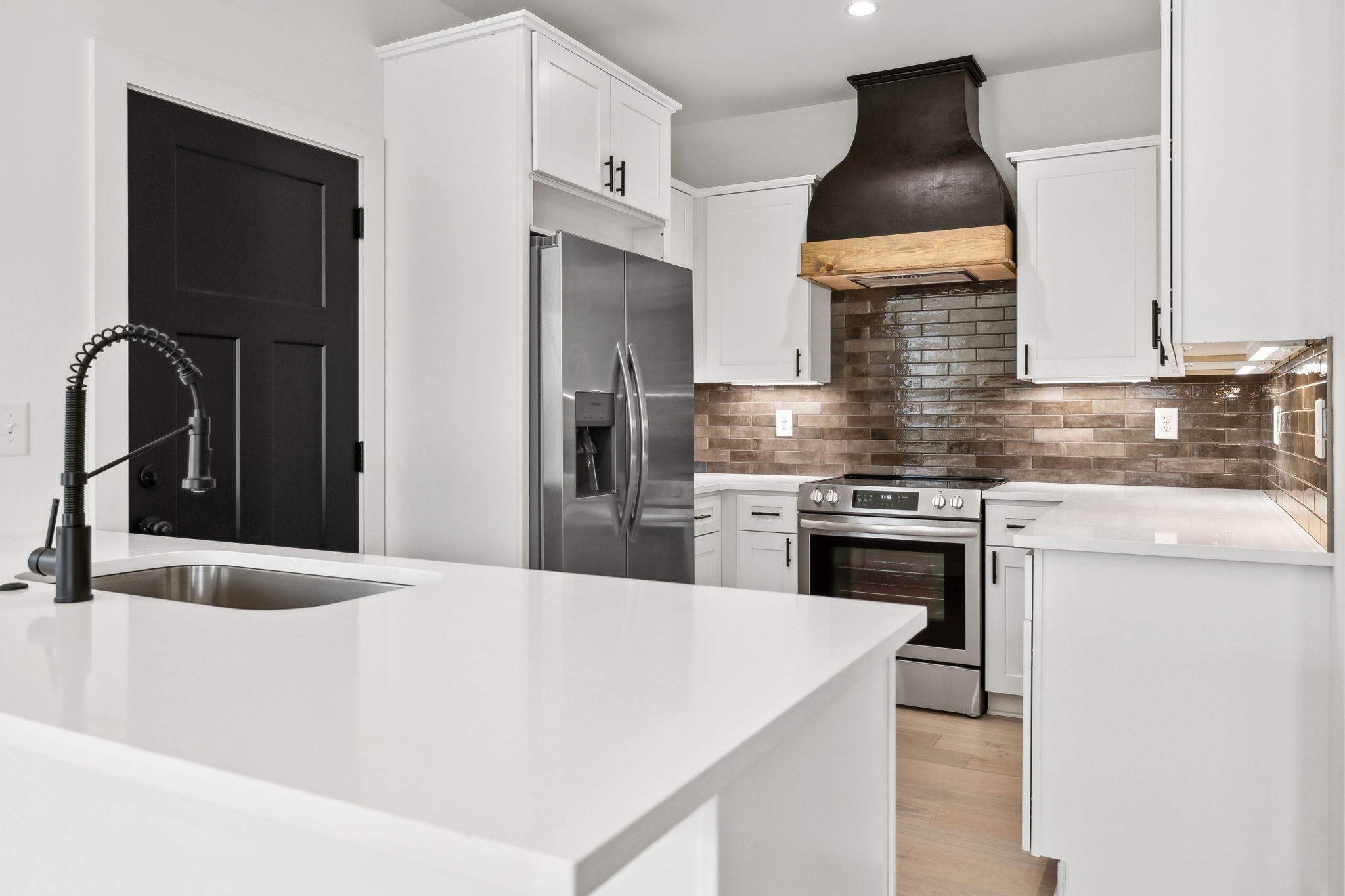 827 Oconnor Street Smithville, TN 37166 - Photo 4 of 24 a kitchen with stainless steel appliances granite countertop a sink stove and refrigerator