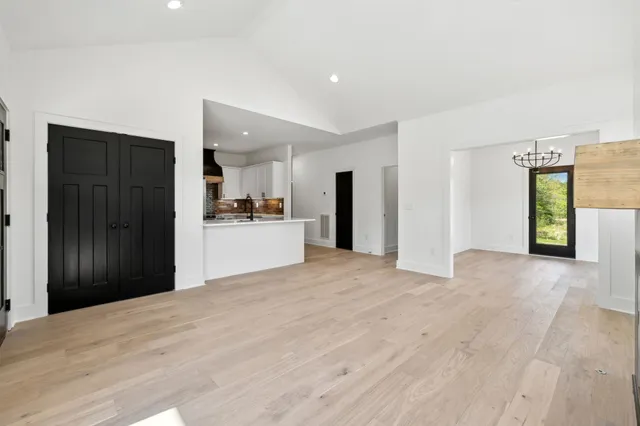 a view of a kitchen with a sink and a window