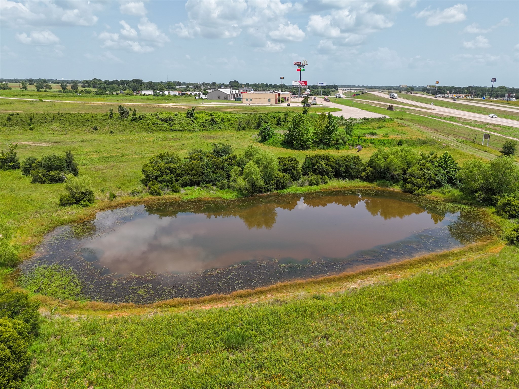 0 290th Bypass Hempstead, TX 77445 - Photo 31 of 32 a view of a lake with a big yard