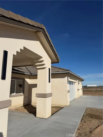 a view of building with car parked