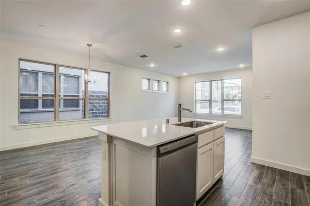 a kitchen that has a lot of cabinets in it